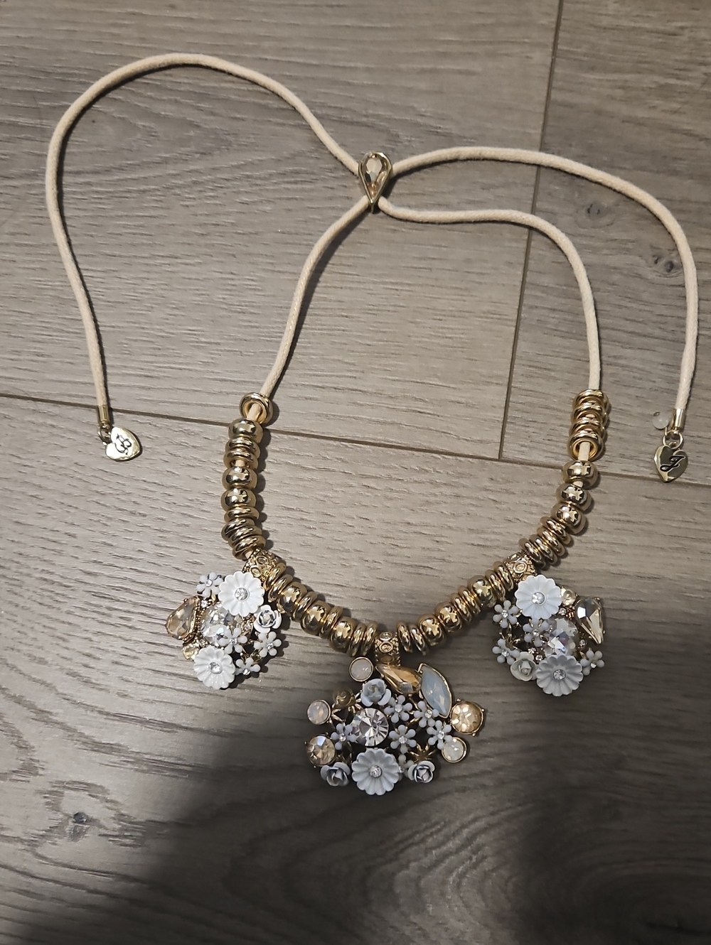 Gold Tone Necklace with White Floral Pendants
